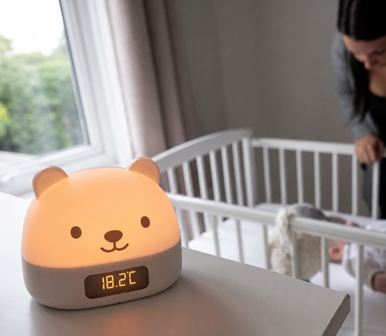 Room thermometer beside a baby's crib